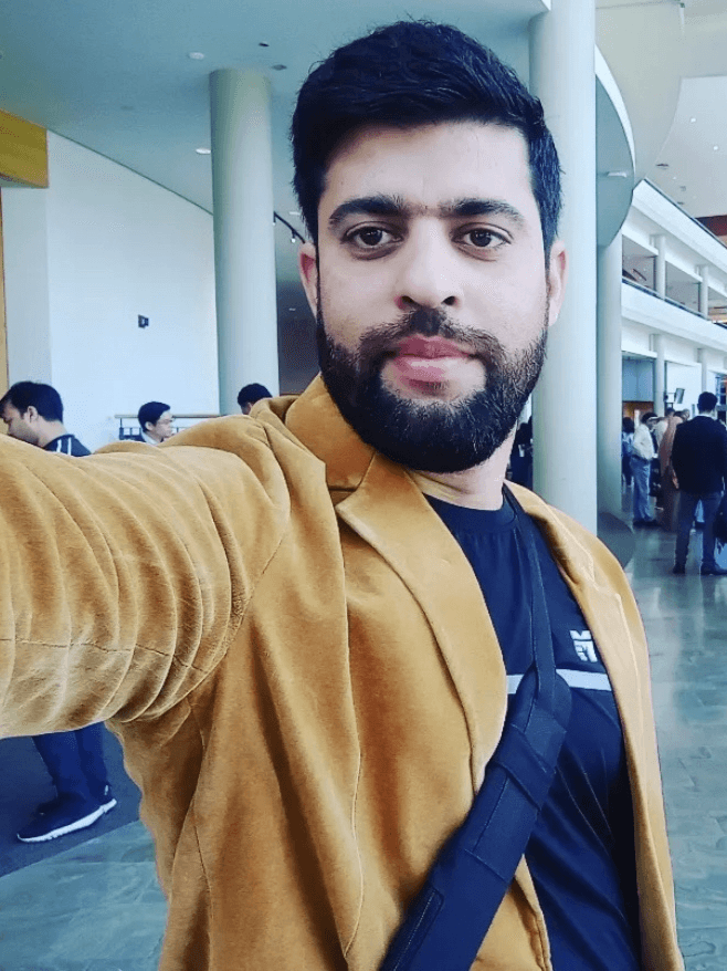 Before: indoor selfie in a tan blazer